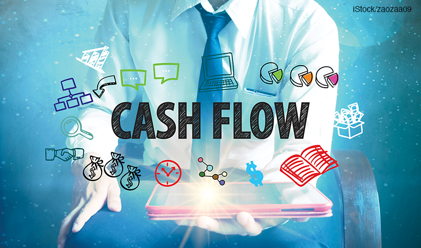 businessman holding a tablet computer with CASHFLOw cashflow